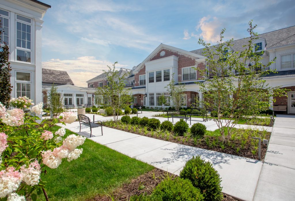 The Gardens at King Bruwaert House - Independent Living - Central Courtyard Photography
